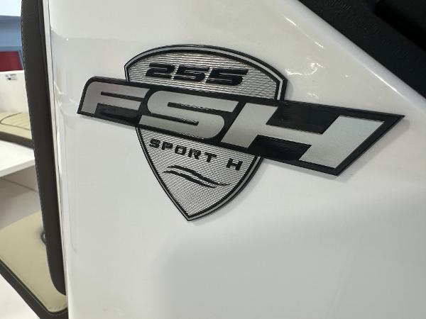 Slide: The Image of 2024 Yamaha Boats 255 FSH Sport H logo on white surface. - 23