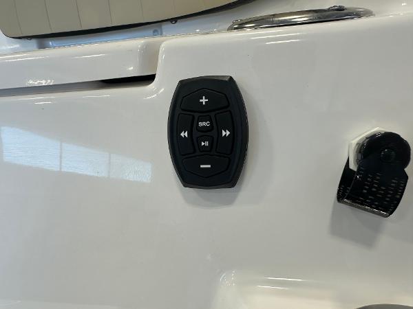 Slide: The Image of Close-up of 2024 Yamaha Boats 255 FSH Sport H control panel. - 26