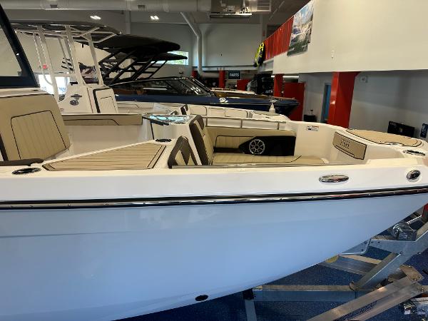 Slide: The Image of 2024 Yamaha Boats 255 FSH Sport H, sleek design, luxury interior, showroom display. - 3