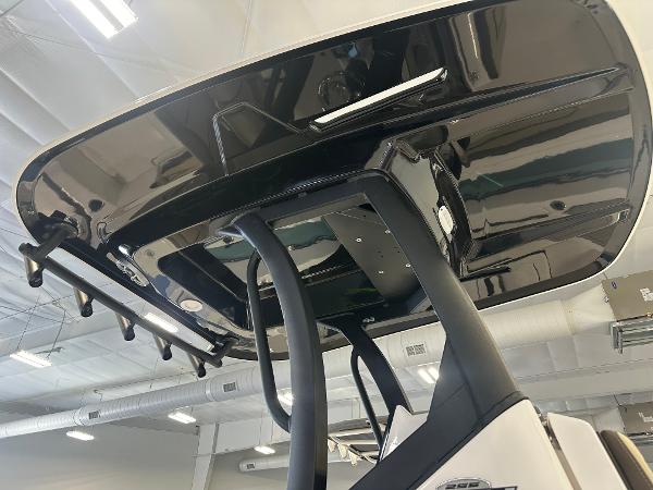 Slide: The Image of 2024 Yamaha Boats 255 FSH Sport H T-top detail in showroom. - 4
