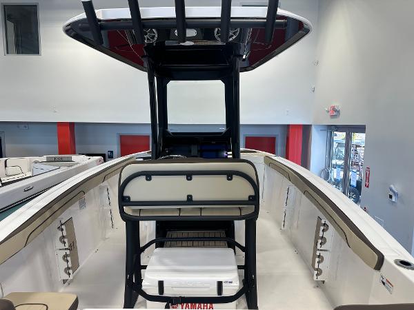Slide: The Image of 2024 Yamaha Boats 255 FSH Sport H interior, showcasing seating and helm station. - 7