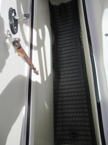 Slide: The Image of 2015 Yamaha Boats AR192 storage compartment with black rubber mat. - 13