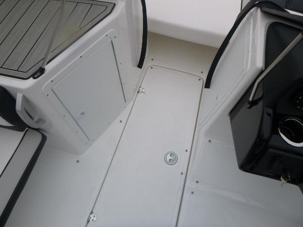 Slide: The Image of 2024 Yamaha AR195 boat interior, featuring sleek white deck and seating area. - 11