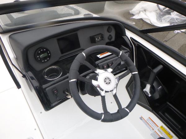 Slide: The Image of 2024 Yamaha AR195 boat dashboard with steering wheel and controls. - 14