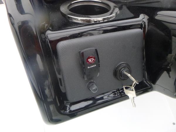 Slide: The Image of 2024 Yamaha AR195 boat ignition panel with keys and blower switch. - 18