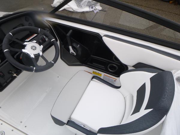 Slide: The Image of 2024 Yamaha AR195 boat interior with steering wheel and seating. - 19
