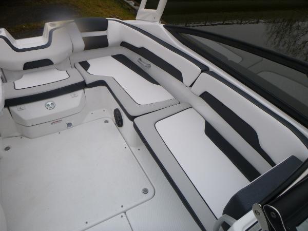 Slide: The Image of 2024 Yamaha AR195 boat interior with sleek white and black seating. - 25