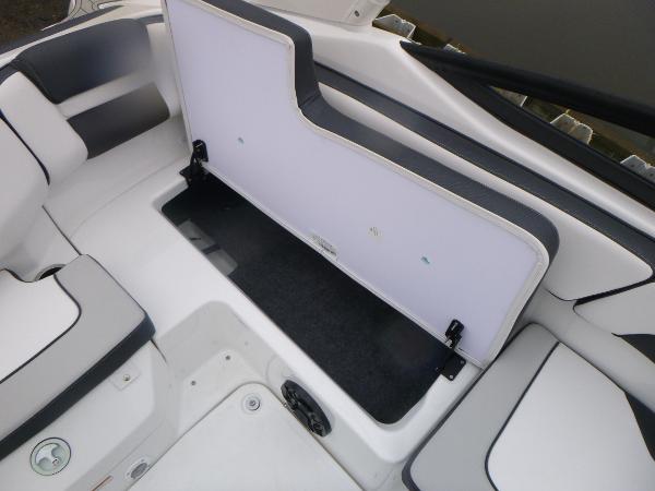 Slide: The Image of 2024 Yamaha AR195 boat interior storage compartment with open seat. - 30