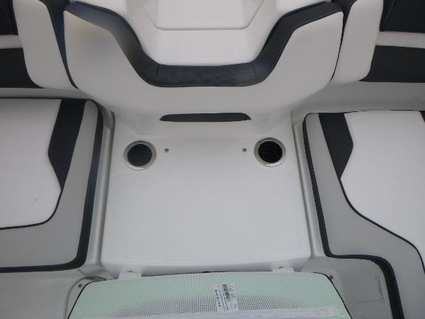 Slide: The Image of 2024 Yamaha AR195 boat interior seating with cup holders. - 32