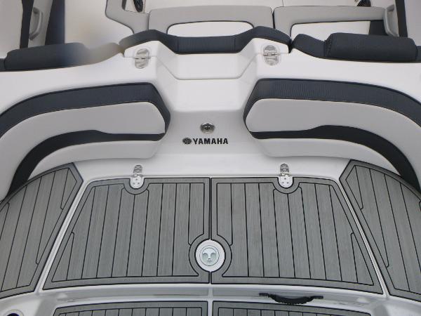 Slide: The Image of 2024 Yamaha Boats AR195 swim platform with sleek seating and modern design. - 33