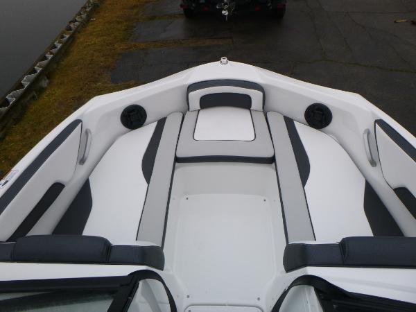 Slide: The Image of 2024 Yamaha AR195 boat interior with sleek white and gray seating. - 5