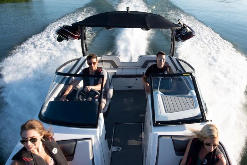 Slide: The Image of 2019 Yamaha Boats AR240 cruising with passengers on a sunny day. - 20
