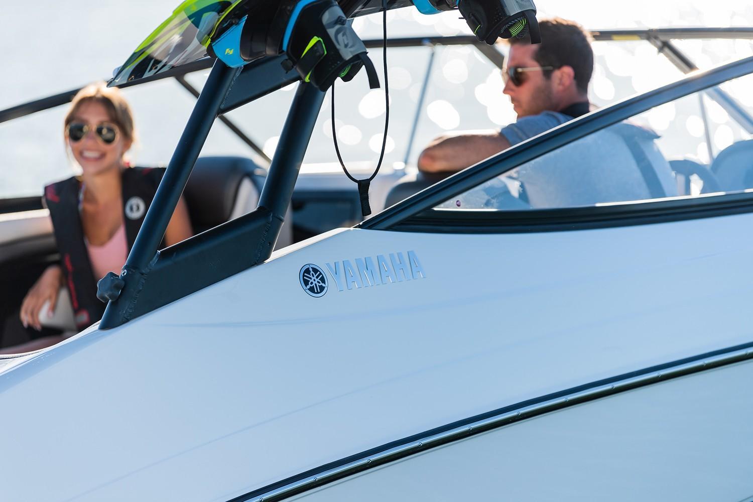 Slide: The Image of 2019 Yamaha AR240 boat with passengers enjoying a sunny day on the water. - 22
