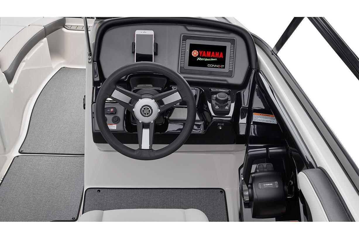 Slide: The Image of 2019 Yamaha AR240 boat dashboard with steering wheel and digital display. - 26