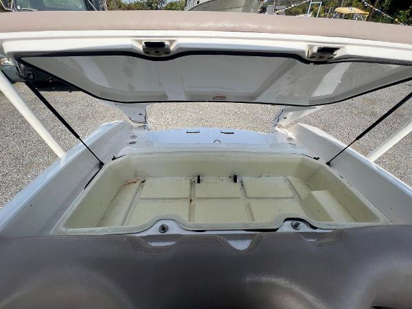 Slide: The Image of Open storage compartment of a 2000 Yamaha Boats LS 2000, showcasing spacious interior. - 13