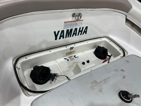 Slide: The Image of Yamaha LS 2000 boat interior, showcasing storage compartment and branding, 2000 model. - 3