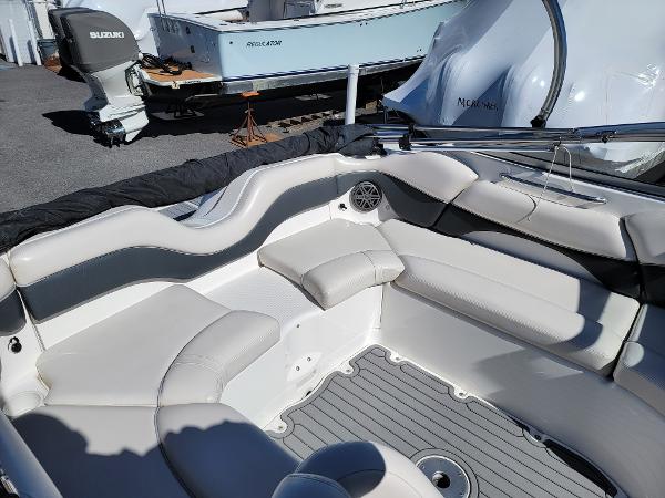 Slide: The Image of 2007 Yamaha SX210 boat interior with gray seating and deck, showcasing spacious design. - 12