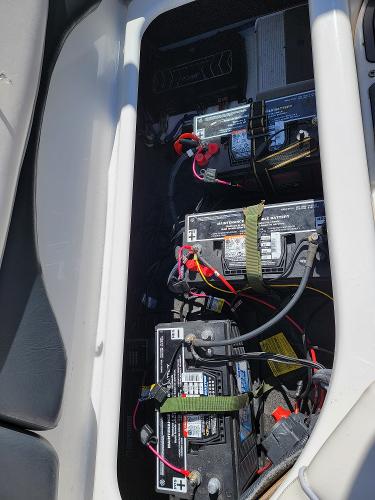 Slide: The Image of 2007 Yamaha SX210 boat battery compartment with multiple batteries and wiring. - 16