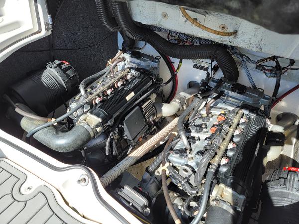Slide: The Image of 2007 Yamaha SX210 boat engine compartment with dual engines and wiring. - 17