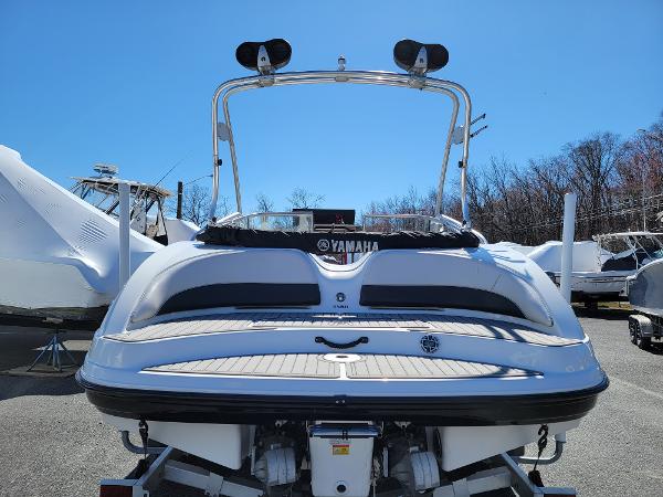Slide: The Image of 2007 Yamaha SX210 boat rear view, parked outdoors on a sunny day. - 5