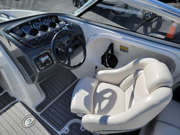 Slide: The Image of 2007 Yamaha Boats SX210 cockpit with steering wheel and plush captain's chair. - 8
