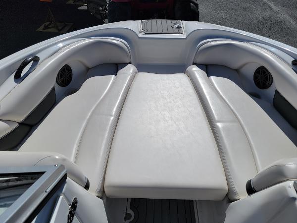 Slide: The Image of 2007 Yamaha SX210 boat interior with white cushioned seating. - 9