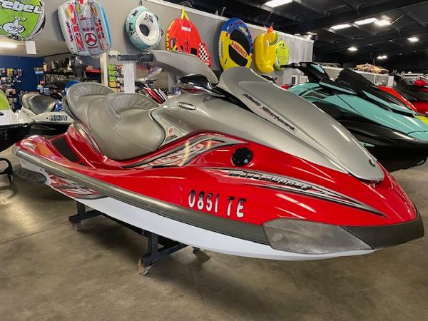 Slide: The Image of 2005 Yamaha WaveRunner FX Cruiser HO in showroom, red and silver design, displayed indoors. - 1