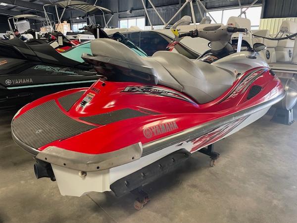 Slide: The Image of 2005 Yamaha WaveRunner FX Cruiser HO in red, parked indoors, side view. - 2
