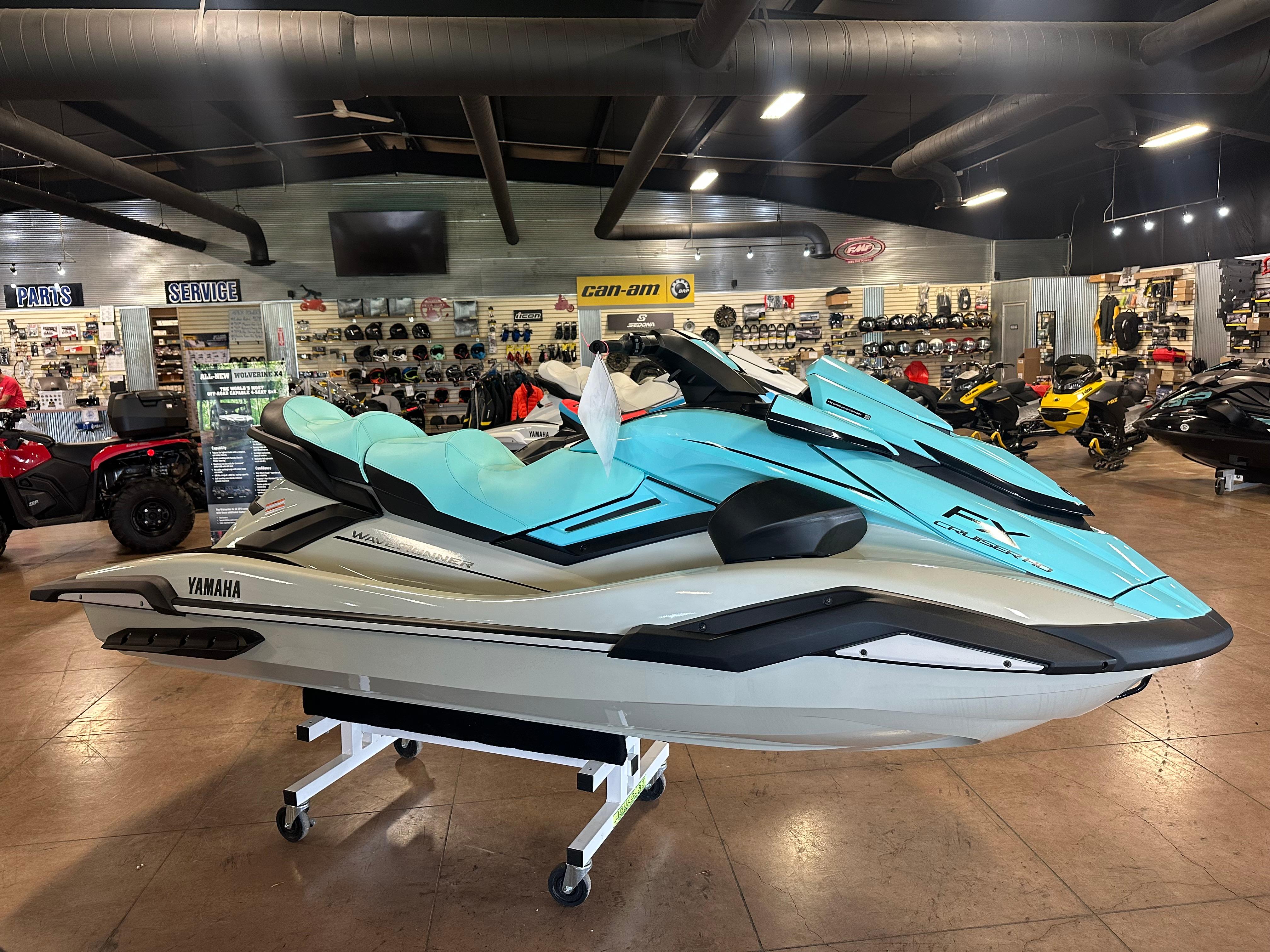 The Image of 2025 Yamaha WaveRunner FX Cruiser HO in showroom, featuring sleek design and vibrant blue color. - 1