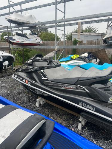 Slide: The Image of 2013 Yamaha WaveRunner FX Cruiser SHO jet ski in storage. - 1
