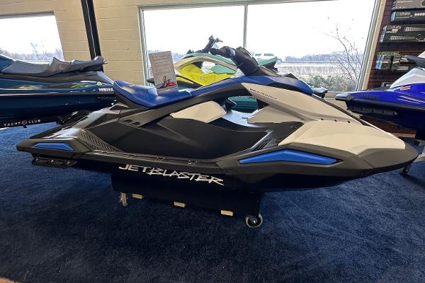 The Image of 2025 Yamaha WaveRunner JetBlaster in showroom, featuring sleek design and blue accents. - 1