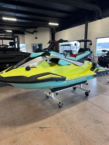 The Image of 2025 Yamaha WaveRunner JetBlaster PRO 2-Up in showroom, vibrant yellow and teal design. - 7