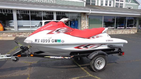 Slide: The Image of 2005 Yamaha WaveRunner VX 110 Sport on trailer outside marine shop. - 1