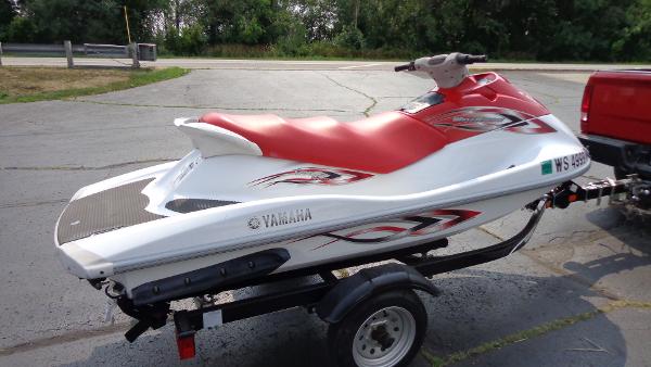 Slide: The Image of 2005 Yamaha WaveRunner VX 110 Sport on trailer, red and white, side view. - 3