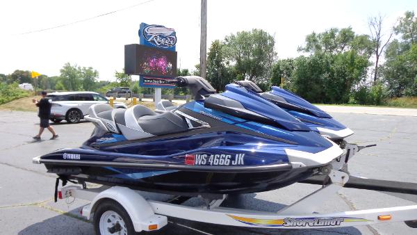 Slide: The Image of 2015 Yamaha WaveRunner VX Cruiser jet skis on a trailer in a parking lot. - 3
