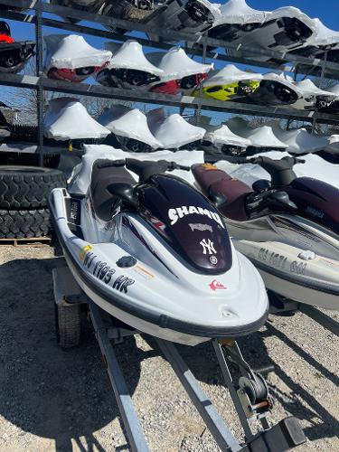 Slide: The Image of 1999 Yamaha WaveRunner XL 1200 jet ski on trailer in storage facility. - 2
