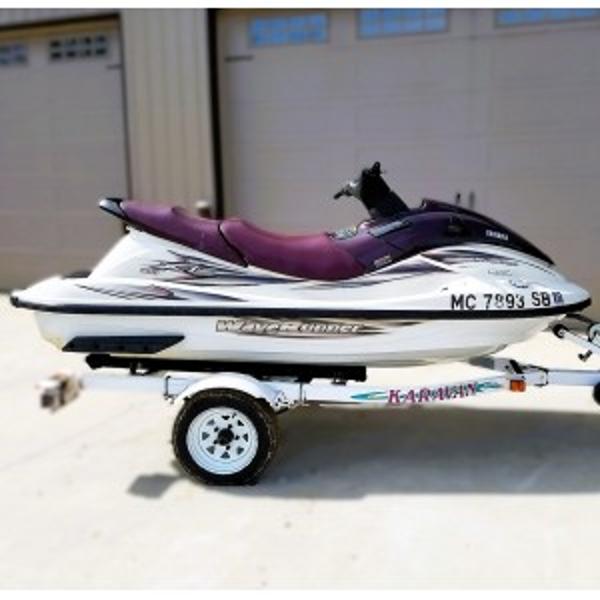 Slide: The Image of 2000 Yamaha WaveRunner XL 800 on trailer, parked outside a garage. - 11
