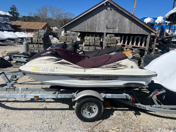 Slide: The Image of 2000 Yamaha WaveRunner XL 800 on a trailer in a yard. - 2