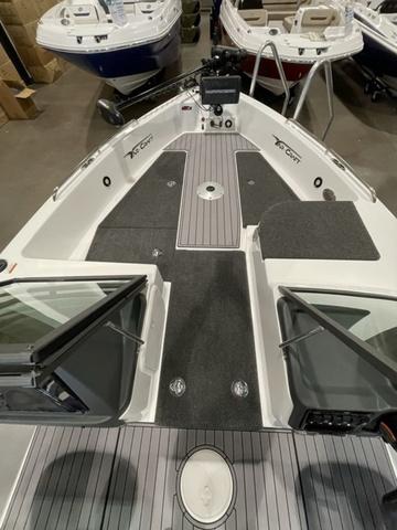 Slide: The Image of 2023 Yar-Craft 209 TFX boat interior, featuring spacious deck and modern controls. - 11