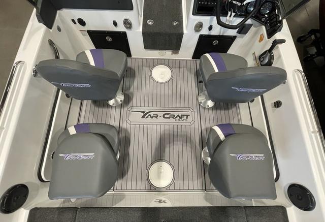 Slide: The Image of 2023 Yar-Craft 209 TFX boat interior with four grey seats and branded flooring. - 6