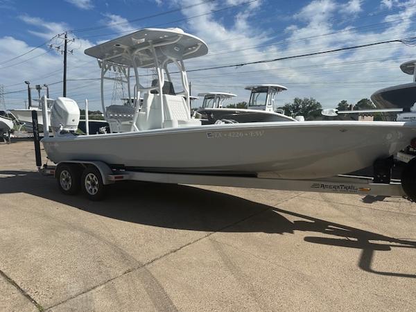 Slide: The Image of 2020 Yellowfin 24 Bay CE boat on trailer under clear sky. - 1