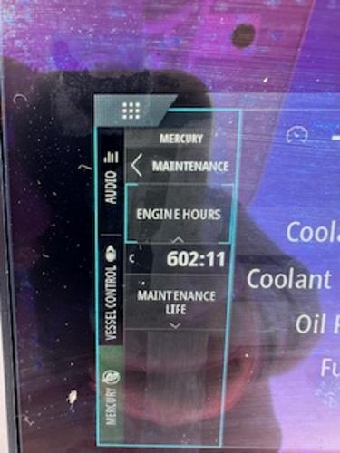 Slide: The Image of Close-up of a 2020 Yellowfin 24 Bay CE boat's display showing 602 engine hours. - 10