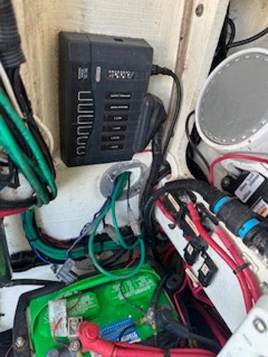 Slide: The Image of 2020 Yellowfin 24 Bay CE boat electrical system with battery and wiring components. - 12