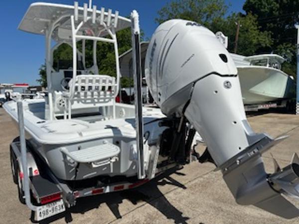 Slide: The Image of 2020 Yellowfin 24 Bay CE boat with powerful outboard motor on trailer. - 14