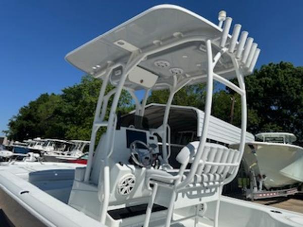 Slide: The Image of 2020 Yellowfin 24 Bay CE boat with T-top and rod holders, docked outdoors. - 15