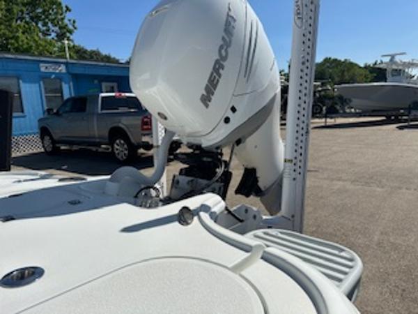 Slide: The Image of 2020 Yellowfin 24 Bay CE boat with Mercury outboard motor in a marina setting. - 16