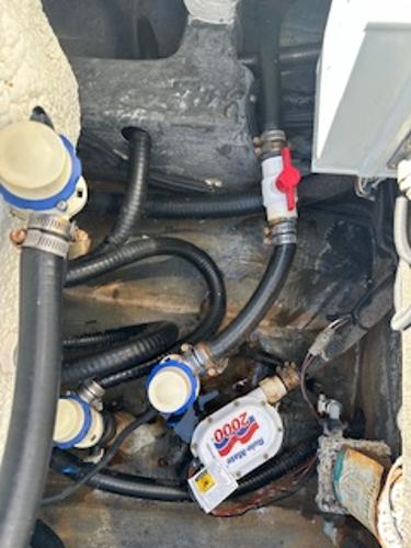 Slide: The Image of 2020 Yellowfin 24 Bay CE boat interior showing plumbing and wiring components. - 18