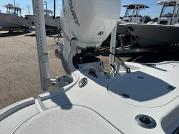 Slide: The Image of 2020 Yellowfin 24 Bay CE boat with Mercury engine in a marina. - 19