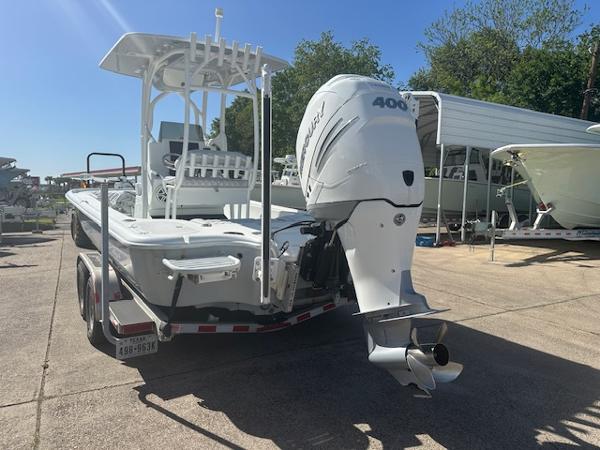 Slide: The Image of 2020 Yellowfin 24 Bay CE boat with powerful outboard motor on trailer. - 2