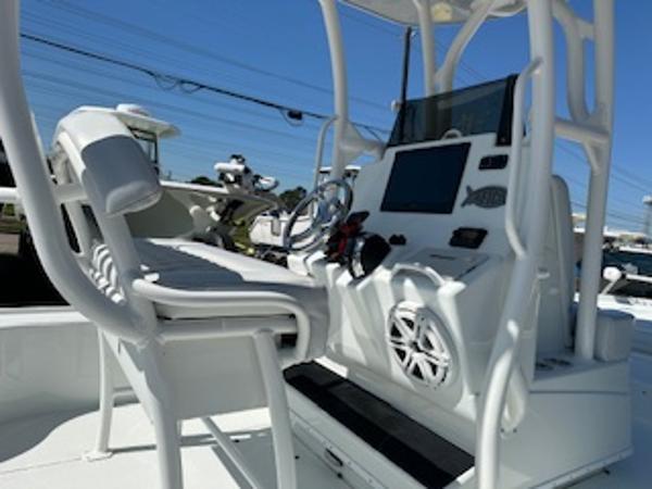 Slide: The Image of 2020 Yellowfin 24 Bay CE boat interior with helm and seating. - 20
